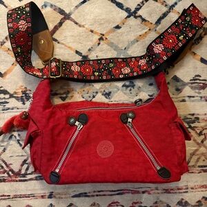 Kipling Vibrant Red Crossbody Bag with Floral Strap